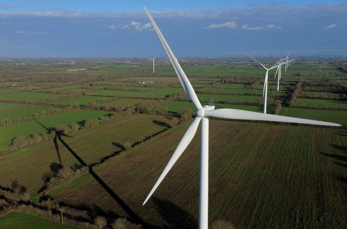 FILE PHOTO: Power-generating windmill turbines at a wind park in Saint-Philbert-de-Bouaine