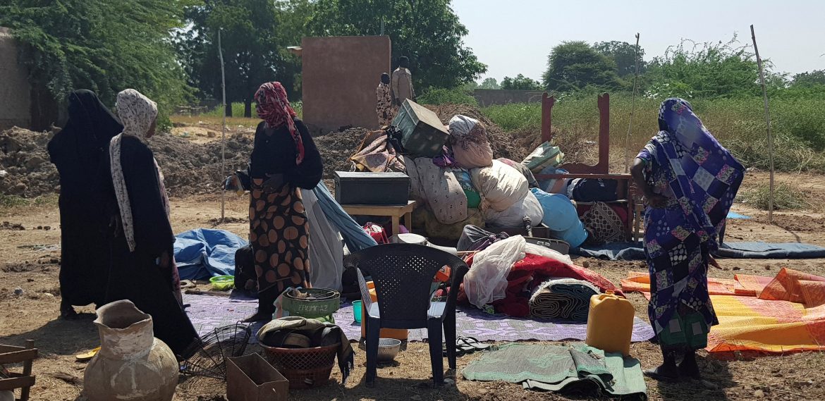Displaced Chadians flee their homes with their belongings after a massive flood in N’djamena