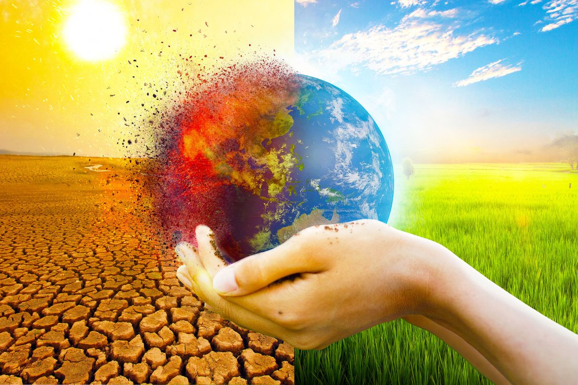 Hand,Of,Young,Man,Hold,World,Globe,With,Burn,Hot