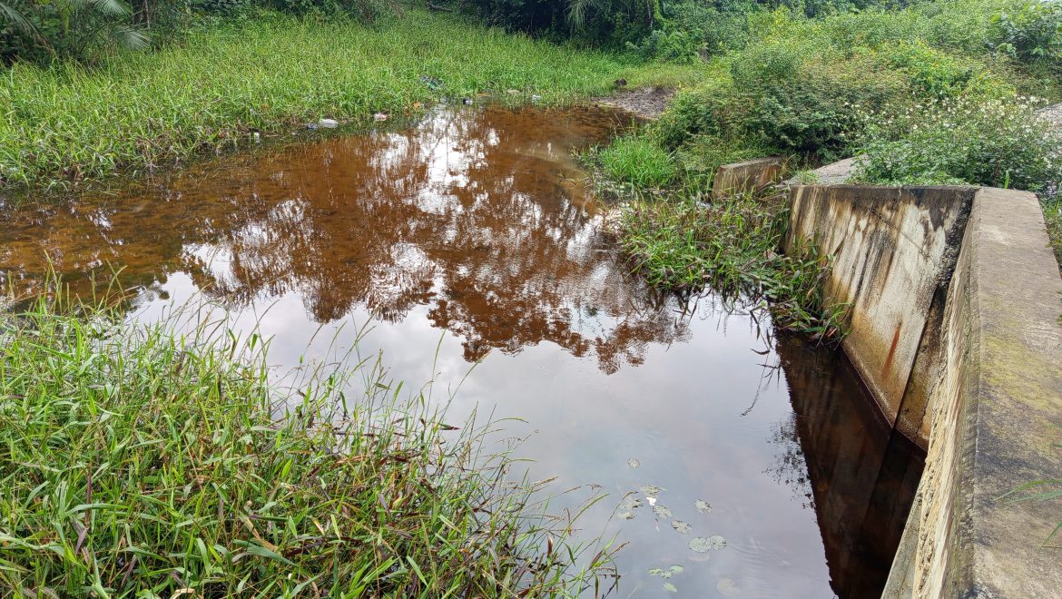 Water body still coated in crude oil